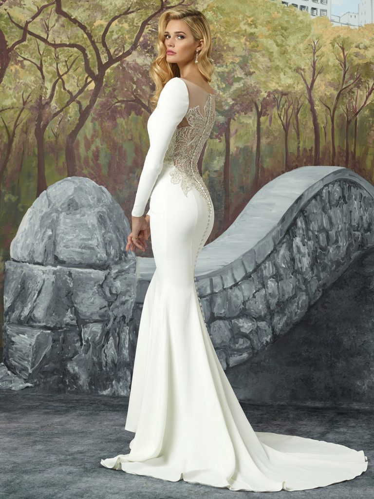Long-sleeved crepe wedding gown by Justin Alexander, available at mcelhinneysbridalrooms.com
