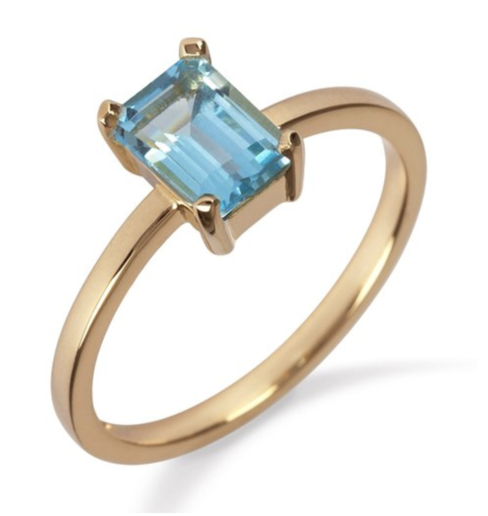 18K yellow gold ring with blue topaz, €695 at momuse.ie